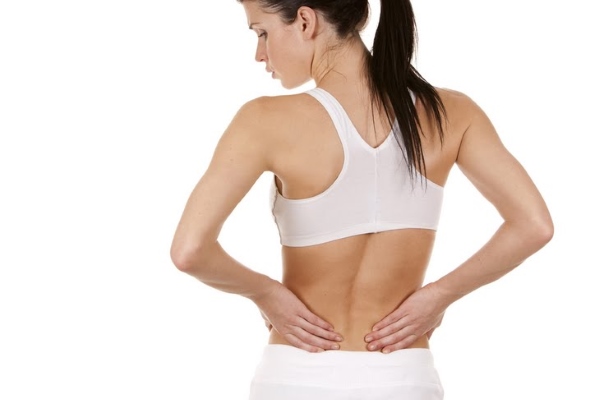 Почему болит спина при месячных