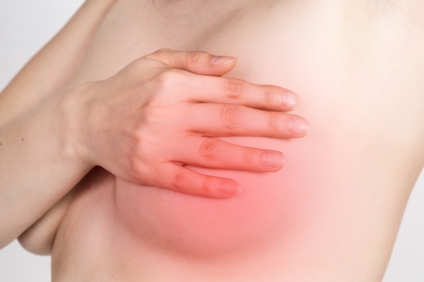 Болит грудь после менструации